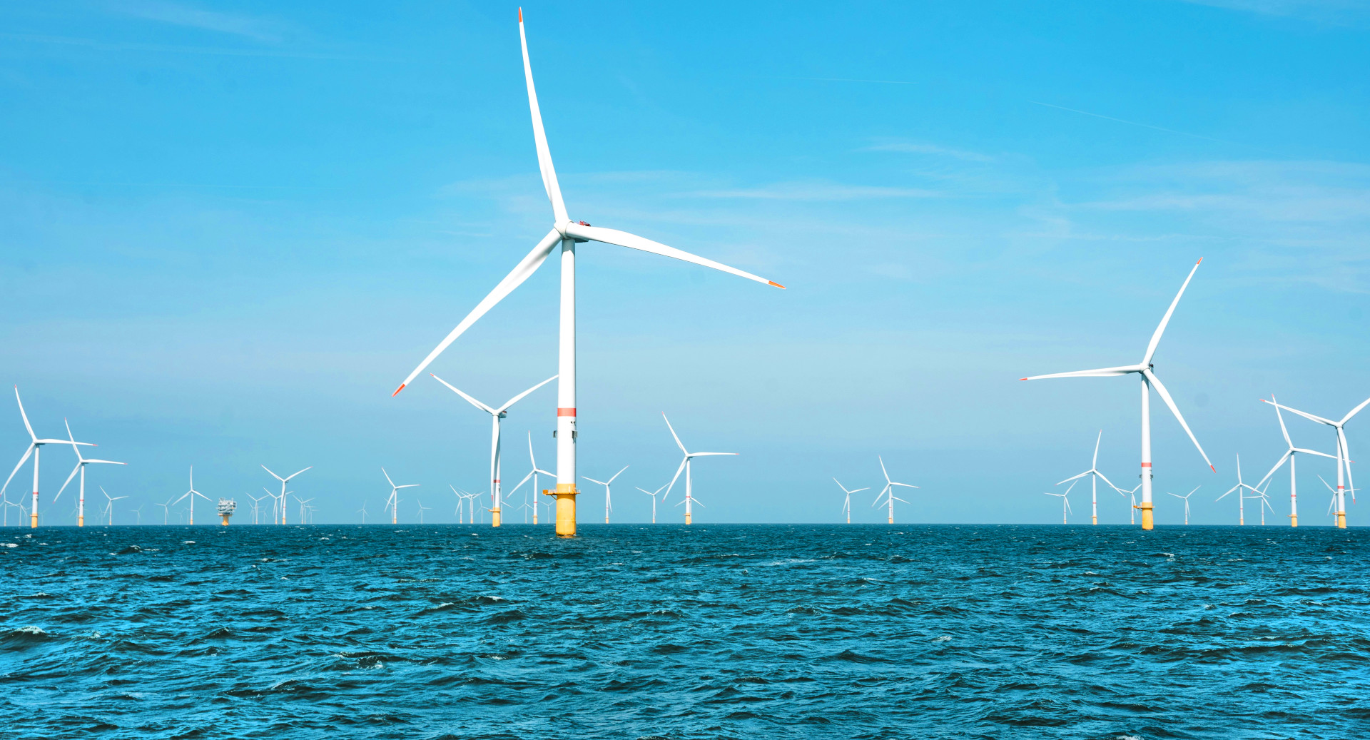 A photo of several offshore wind turbines